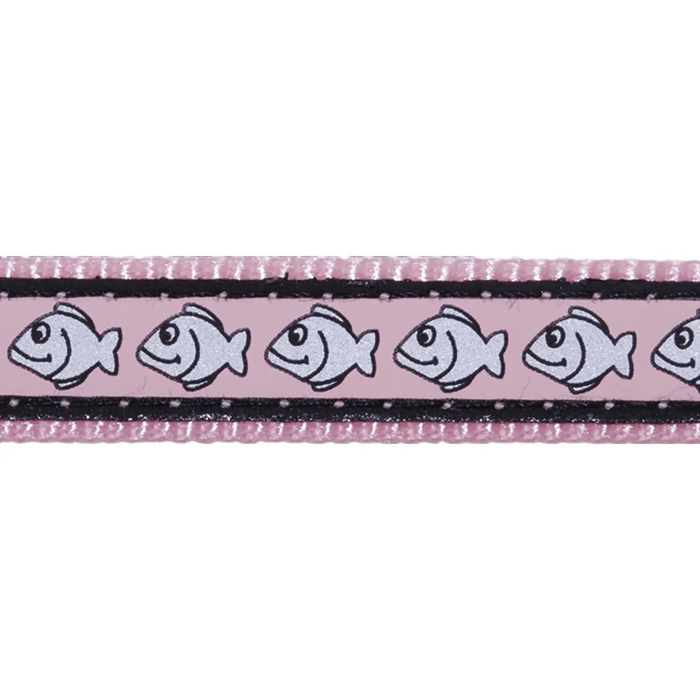 White background with a close up view of a pink cat collar with silver reflective fish on it.
