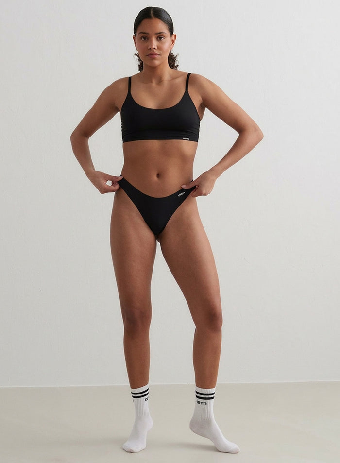 Model wearing the Black Invisible Thong 3-Pack from aim'n