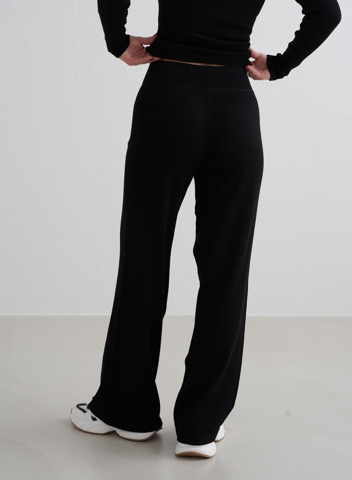 Black aim'n Ribbed Wool Petite Wide Pants featuring a cosy ribbed texture and wide-leg fit from behind. [XS - 162 cm]