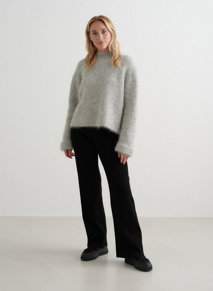 High-waisted black aim'n Ribbed Wool Wide Pants styled with a grey fuzzy sweater and platform shoes [XS - 170 cm]