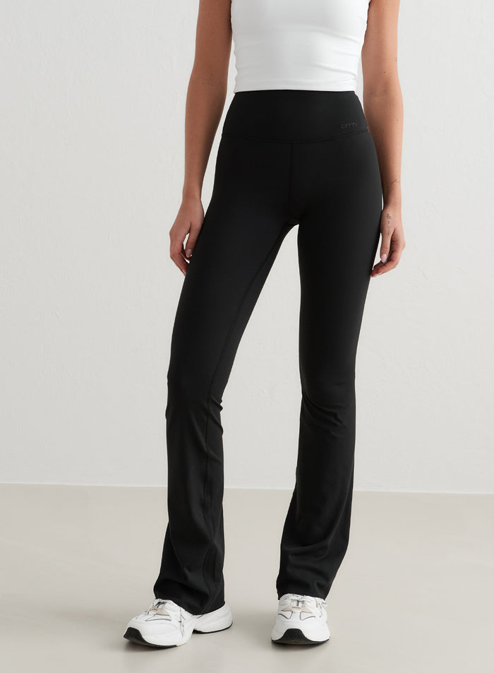 Black high-waisted Sense Flare Tights by aim'n featuring a flared leg in buttery-soft squat proof fabric.