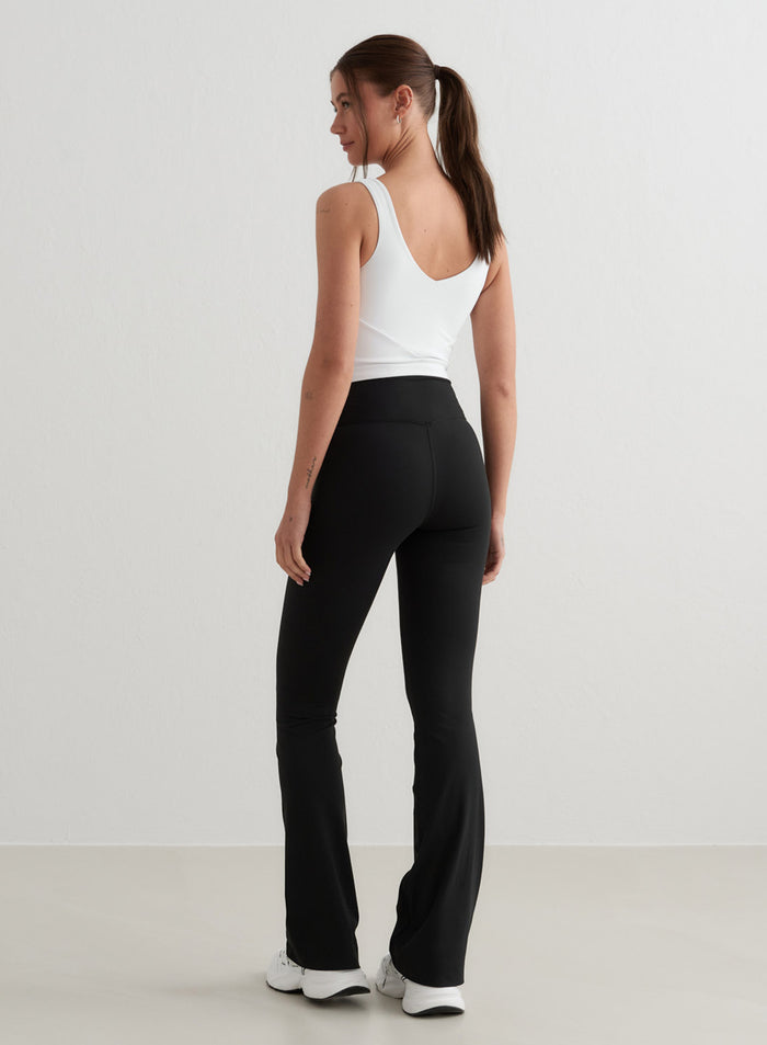 Black Sense Flare Tights by aim'n featuring a high waist, flared leg and squat proof second skin fabric.