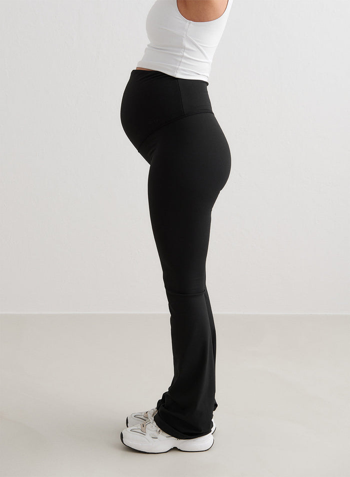 Black aim'n Sense Maternity Flare Tights featuring a high waistband and flared leg silhouette.