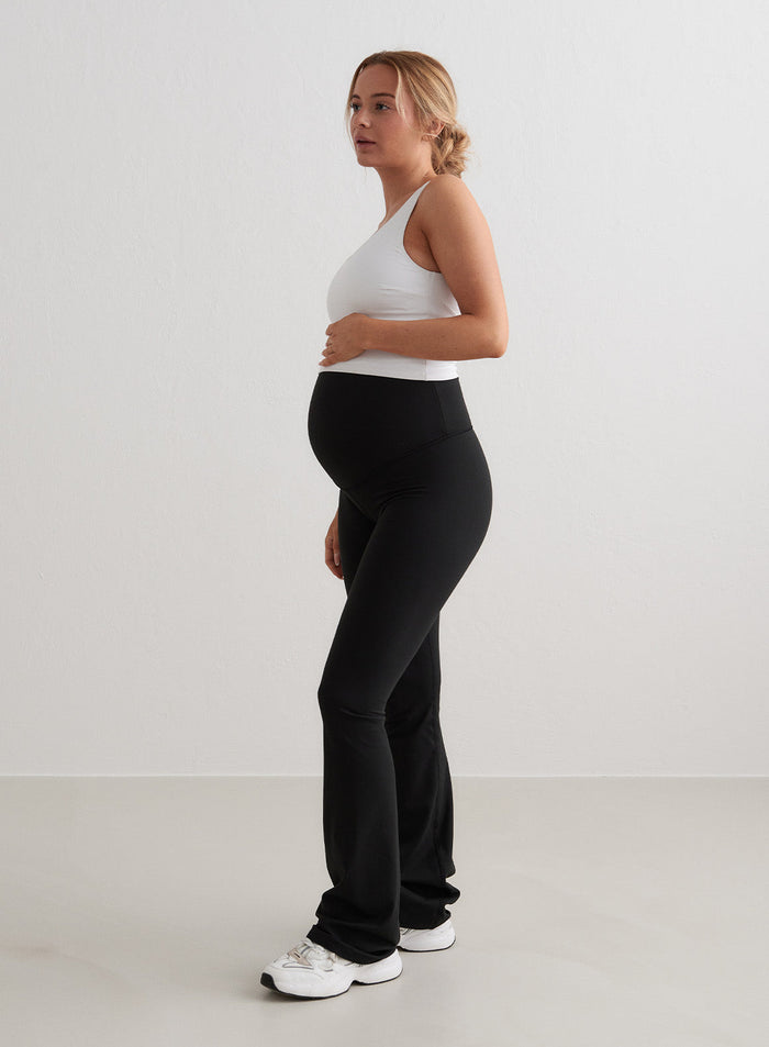 Black aim'n Sense Maternity Flare Tights with a high supportive waistband and soft flared legs.