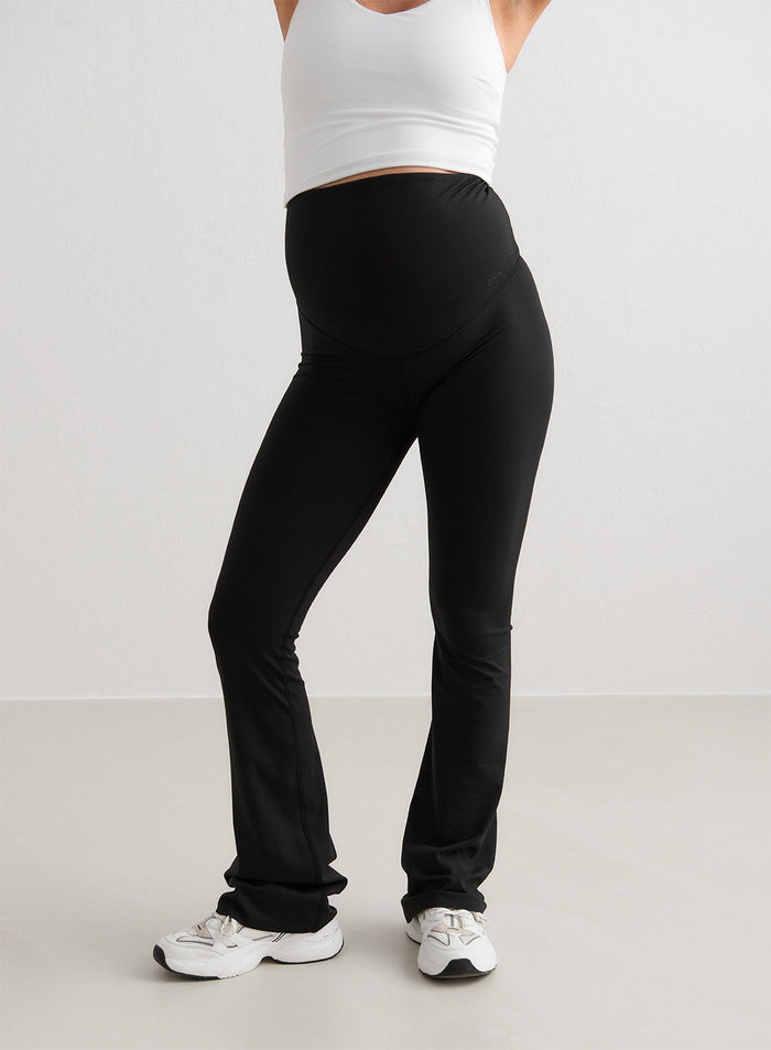 Black flared maternity tights by aim'n featuring a high waistband for a soft second skin feel.