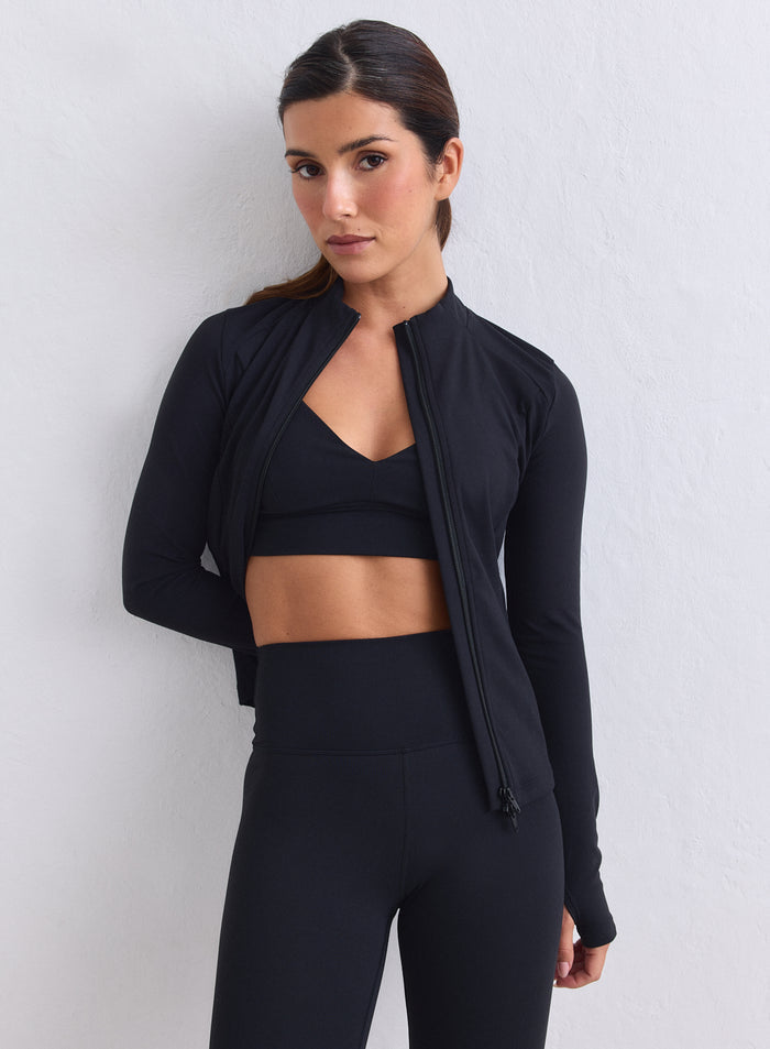 Black aim'n Sense Zip Jacket in peachy soft fabric featuring thumbholes and a two-way zip. [XS-165cm]