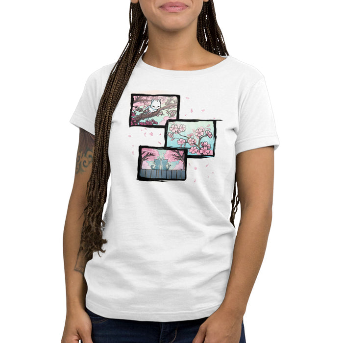 Premium Cotton T-shirt_TeeTurtle white Cherry Blossom Cats apparel featuring three panels, with the first one featuring a white cat sitting among the branches of a cherry blossom tree, the second one featuring a blooming cherry blossom branch, and the third one featuring two white cats sitting on a fence looking at cherry blossom trees.