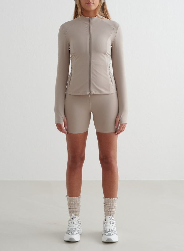 Dark clay Sense Midi Biker Shorts by aim'n with a second skin feel, paired with a matching jacket and white sneakers. [S - 175 cm]