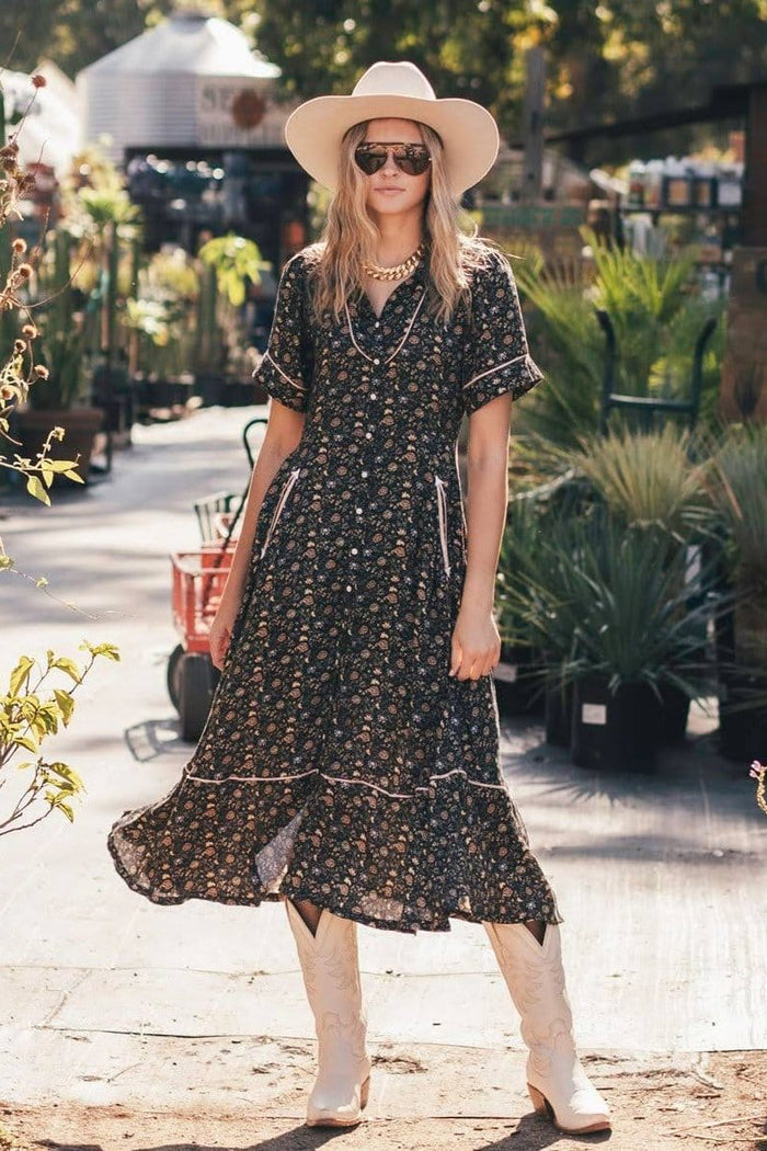 Woman shopping in floral dress and hat