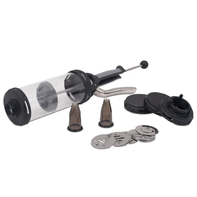A pressure syringe with a clear container, metallic parts and black rubber components, alongside two nozzle attachments.