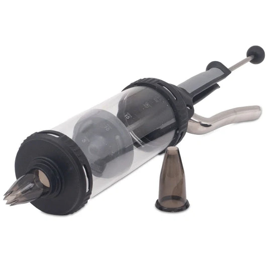 A pressure syringe with a clear container, metallic parts and black rubber components, alongside two nozzle attachments.