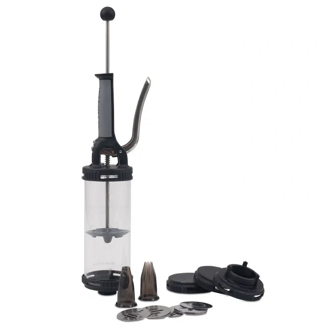 A pressure syringe with a clear container, metallic parts and black rubber components, alongside two nozzle attachments.