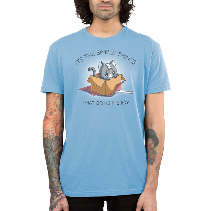 Premium Cotton T-shirt_TeeTurtle light blue Purr Box of Joy apparel featuring a gray cat in an unwrapped box with wrapping paper and ribbons, and the caption, “It’s the Simple Things That Bring Me Joy“.