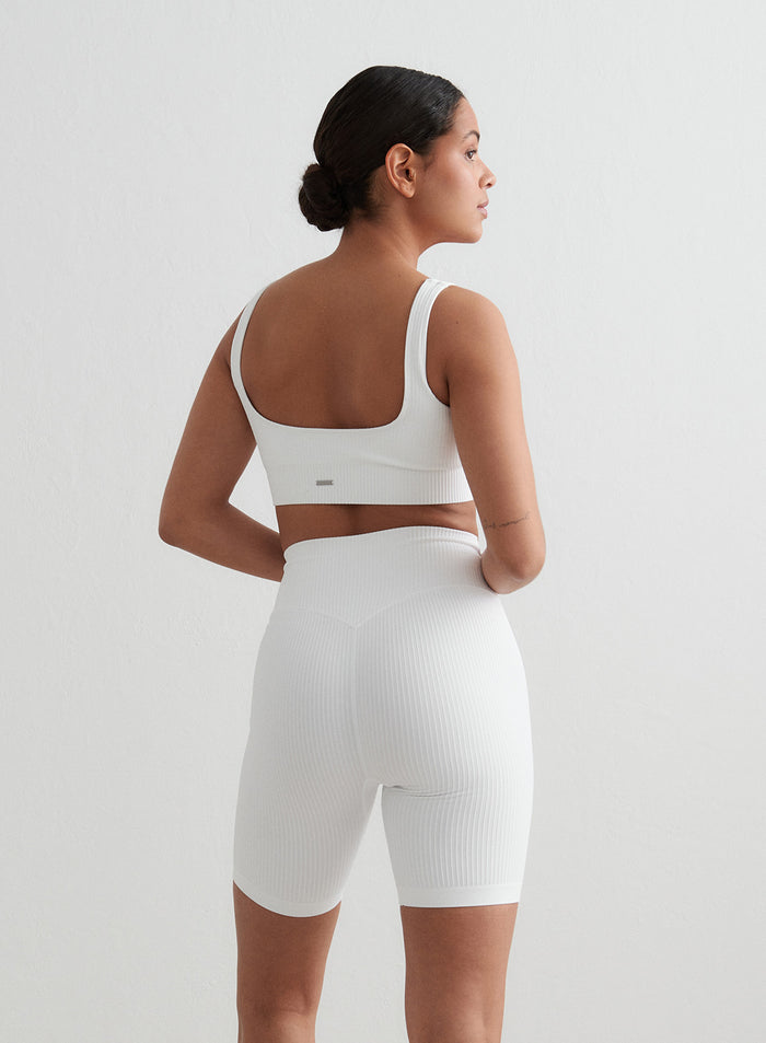 White Ribbed Seamless Biker Shorts and matching bra by aim'n, viewed from a rear angle. [S - 176 cm]