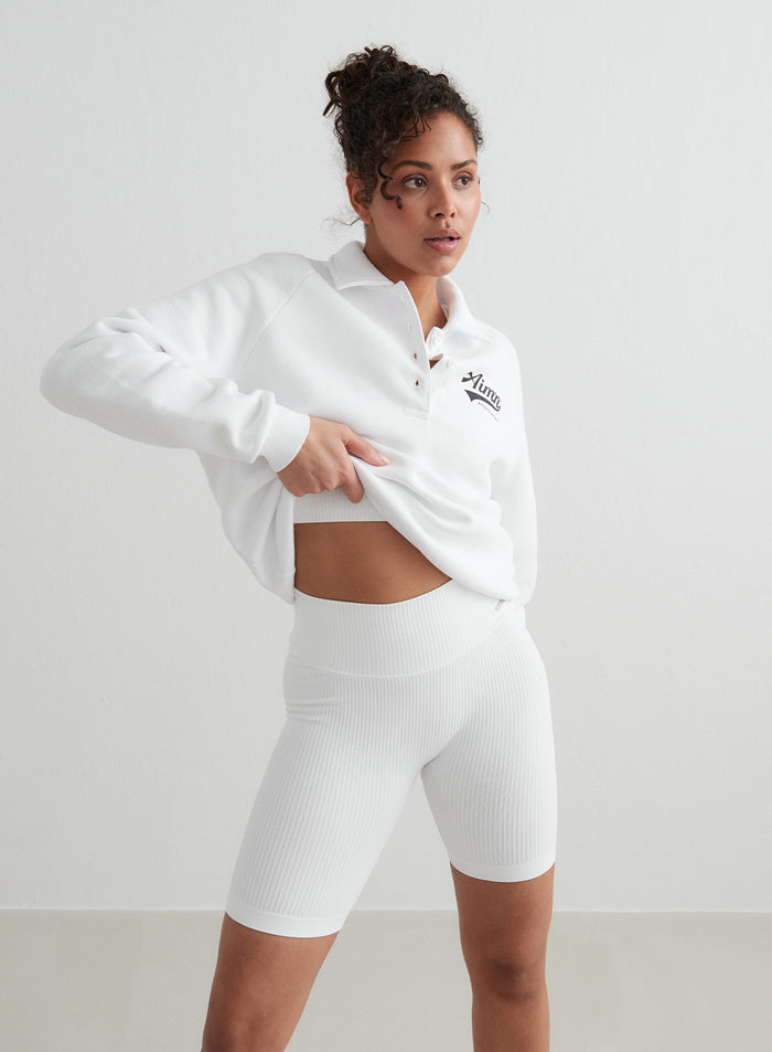 White high-waisted Ribbed Seamless Biker Shorts and a matching polo sweatshirt with an aim'n logo [S - 176 cm]