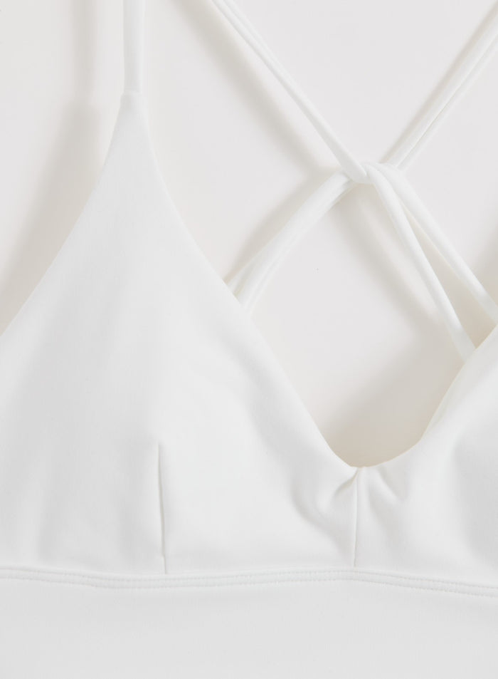 White Sense Strap Bra by aim'n featuring a V-neck and decorative strappy back detail.